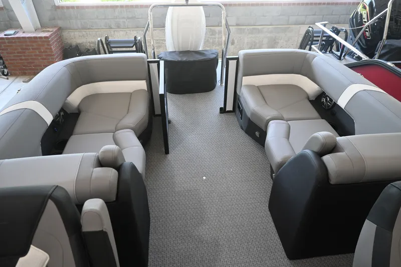 Slide: The Image of The image shows the interior of a 2027 Evotti 521QL boat with gray and white seating. - 9