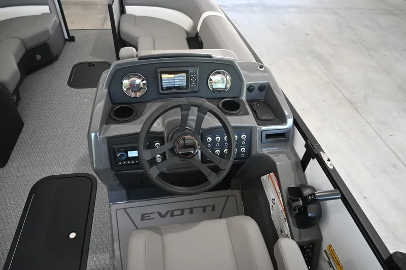 Slide: The Image of The image shows the cockpit of a 2027 Evotti 521QL with a modern helm station. - 13