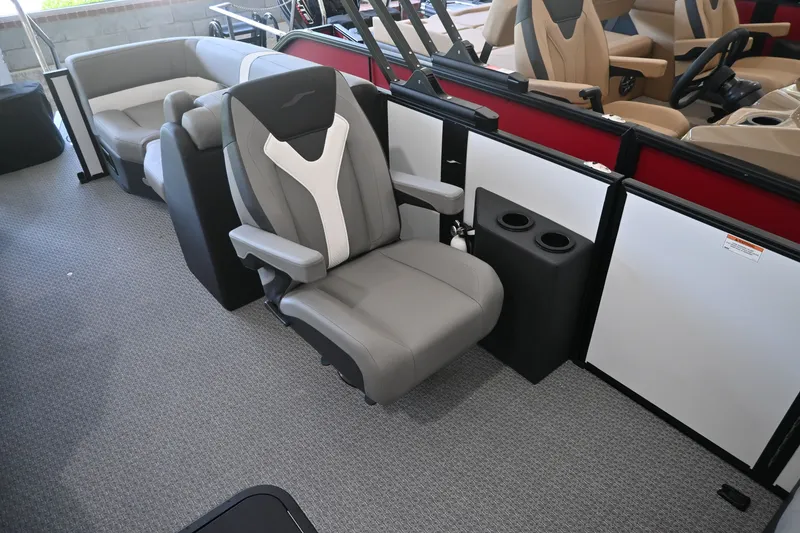 Slide: The Image of A luxurious gray captain's chair with armrests and cup holders in a modern boat. - 7