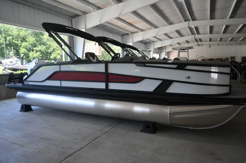 The Image of A 2027 Evotti 521QL pontoon boat is in a covered area. It features a modern design. - 1