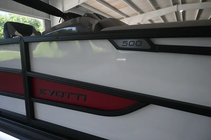Slide: The Image of The image shows the side of an Evotti 521QL boat with a sleek design. - 3