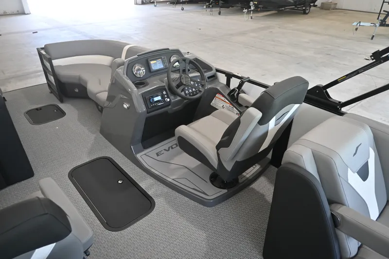 Slide: The Image of The image shows the cockpit of a 2027 Evotti 521QL with modern instruments and gray seating. - 12