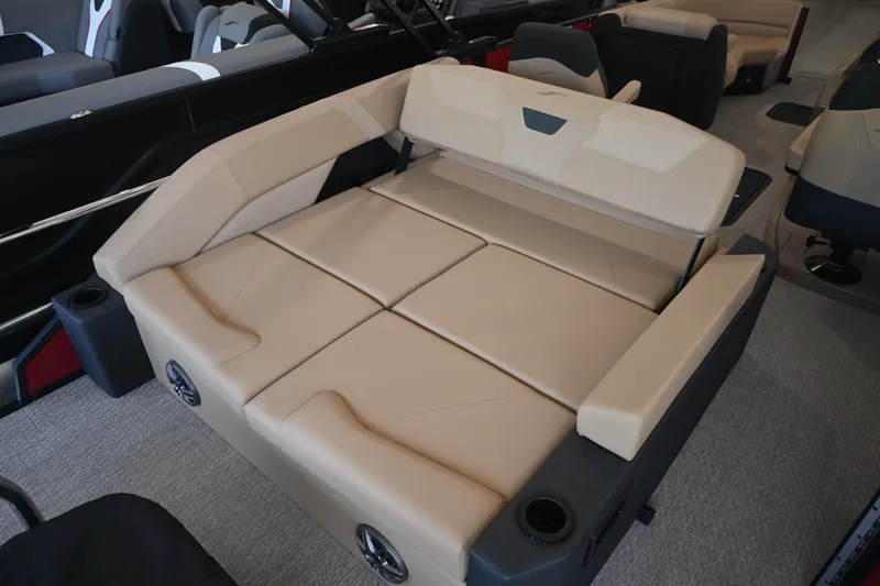 Slide: The Image of The image shows a luxurious beige lounging area on a boat, surrounded by speakers. - 14