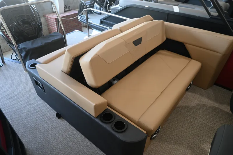 Slide: The Image of The image shows a beige bench seat in a modern boat, surrounded by black interior. - 18