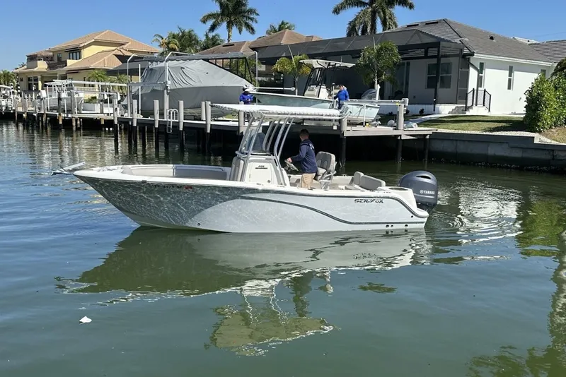 The Image of 2014 Sea Fox 226 Commander boat cruising near waterfront homes. - 0