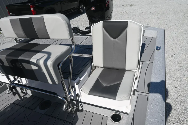 Slide: The Image of The image shows the seats of a 2027 Vexus ACX2000 boat with gray and black upholstery. - 10