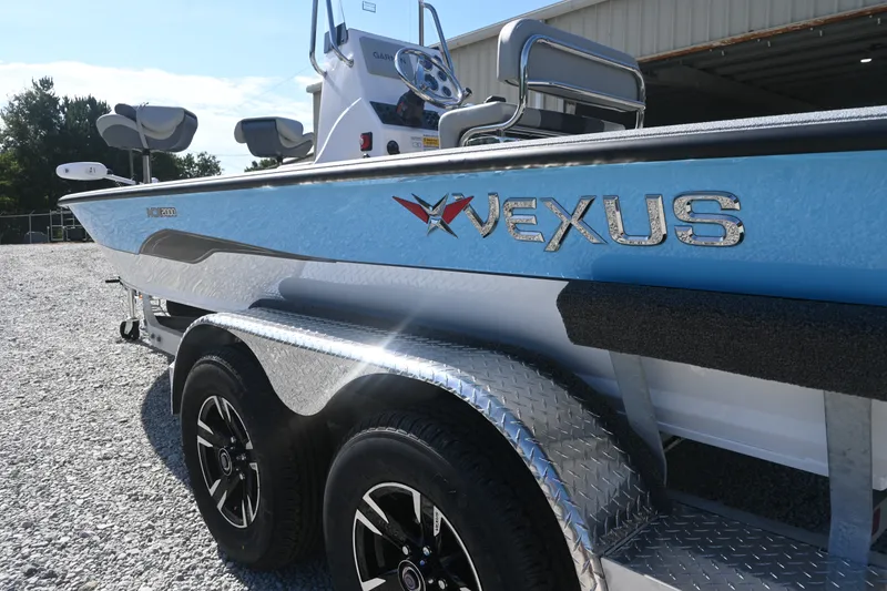 Slide: The Image of A 2027 Vexus ACX2000 boat on a trailer. It features a blue exterior. - 4