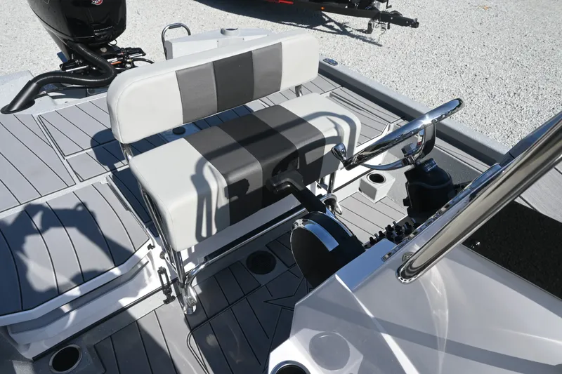 Slide: The Image of The image shows the cockpit of a Vexus ACX2000 boat with gray upholstery and a helm station. - 8