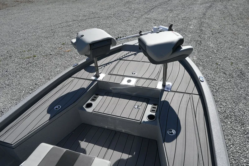 Slide: The Image of The image shows the deck of a Vexus ACX2000 boat with two cushioned seats. - 7