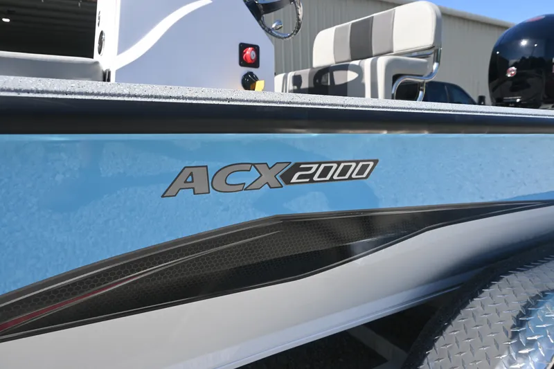 Slide: The Image of The image shows a 2027 Vexus ACX2000 boat with a blue hull and modern design. - 5