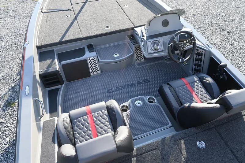 Slide: The Image of The image shows the cockpit of a 2027 Caymas 201 Pro boat with two cushioned seats. - 6