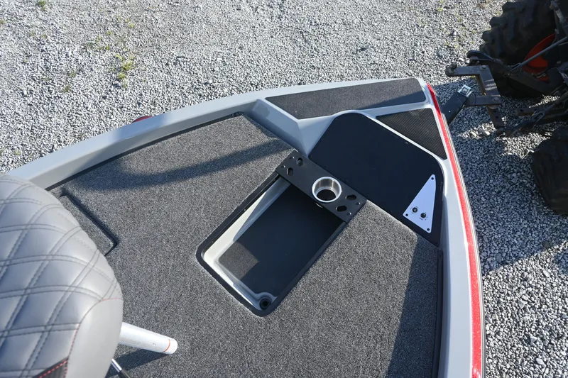 Slide: The Image of The image shows the bow deck of a Caymas 201 Pro boat with gray carpeting. - 9