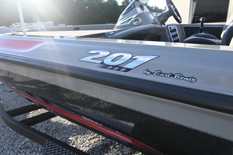 Slide: The Image of The image shows a 2027 Caymas 201 Pro boat with a sleek design. - 5