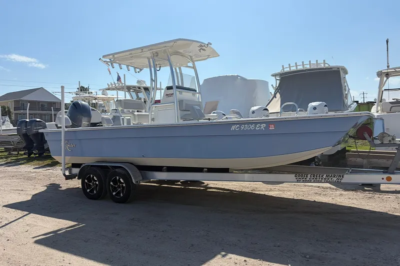 Slide: The Image of 2021 KenCraft BAYRIDER 2260FS boat on trailer, parked outdoors under clear sky. - 6