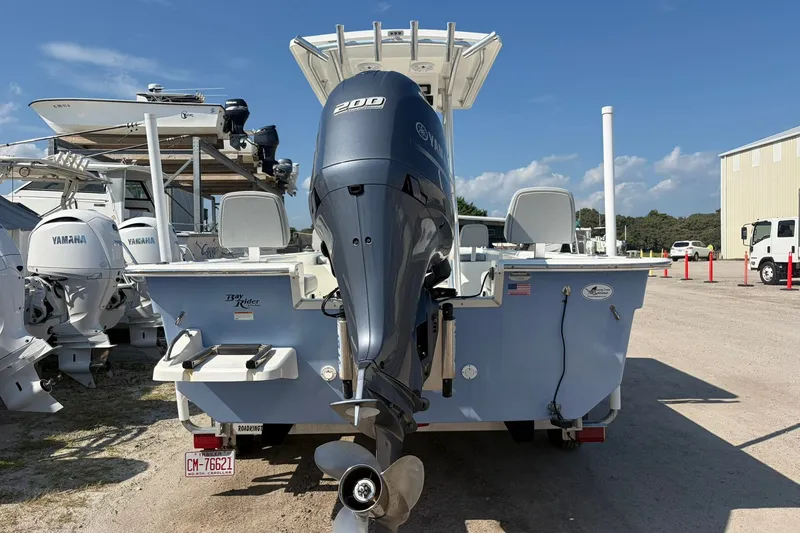 Slide: The Image of 2021 KenCraft BAYRIDER 2260FS boat with Yamaha outboard motor in a marina. - 8