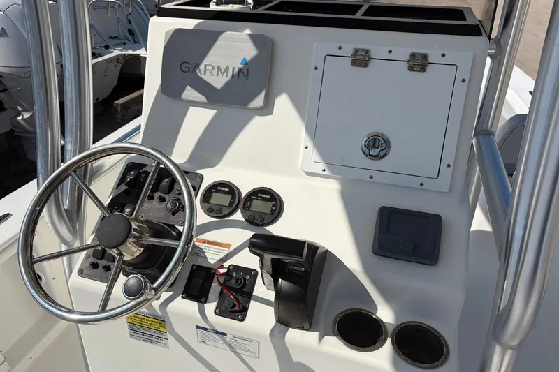 Slide: The Image of 2021 KenCraft BAYRIDER 2260FS boat console with Garmin navigation system and steering wheel. - 20