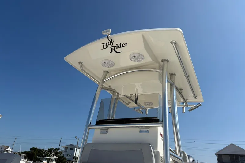 Slide: The Image of 2021 KenCraft BAYRIDER 2260FS boat with T-top under clear blue sky. - 14