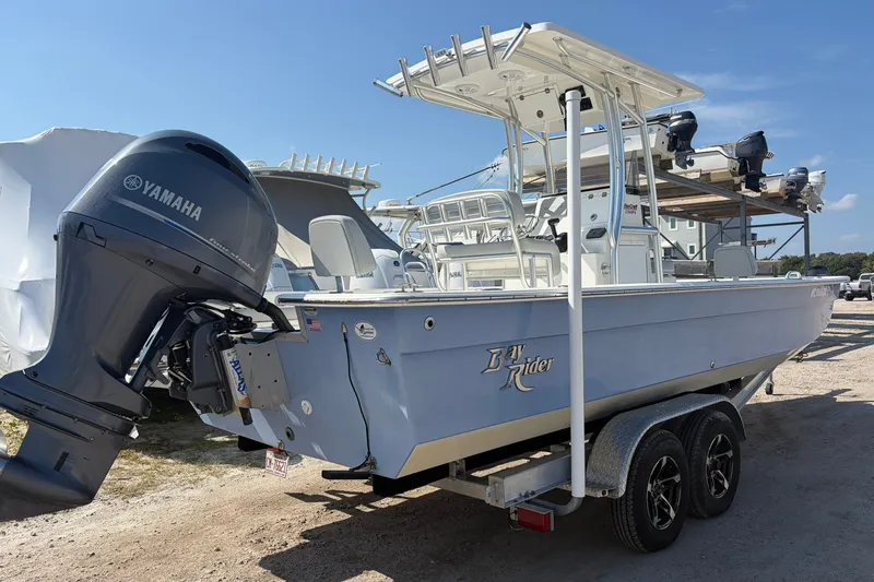 Slide: The Image of 2021 KenCraft BAYRIDER 2260FS boat with Yamaha engine on trailer, parked outdoors. - 7