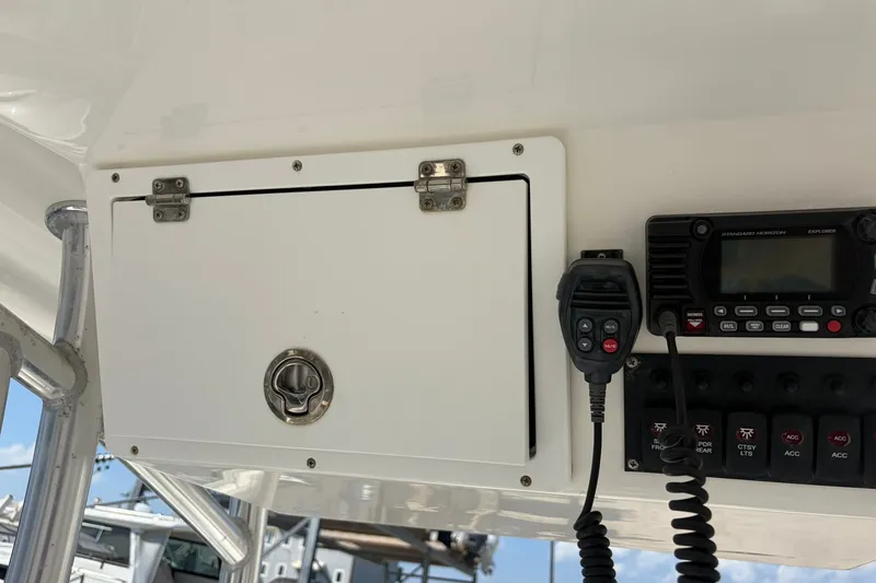 Slide: The Image of 2021 KenCraft BAYRIDER 2260FS boat console with radio and control panel. - 19
