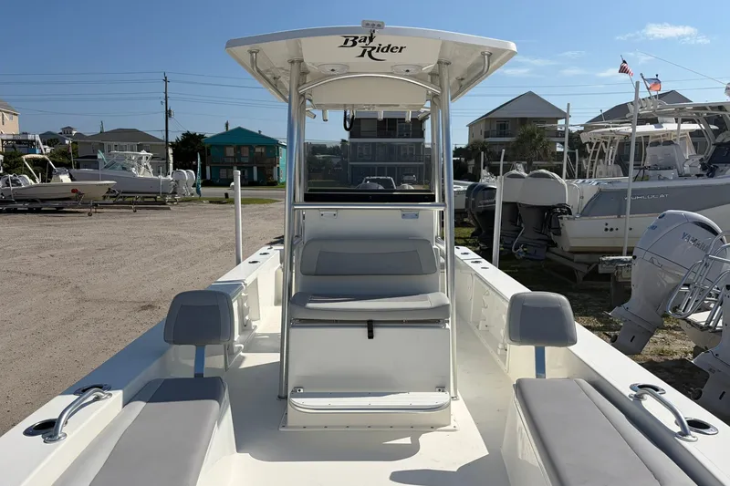 Slide: The Image of 2021 KenCraft BAYRIDER 2260FS boat with seating and console, docked outdoors. - 16