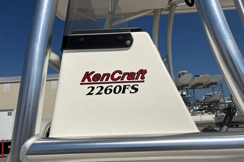 Slide: The Image of 2021 KenCraft BAYRIDER 2260FS boat detail with logo and metal frame. - 12