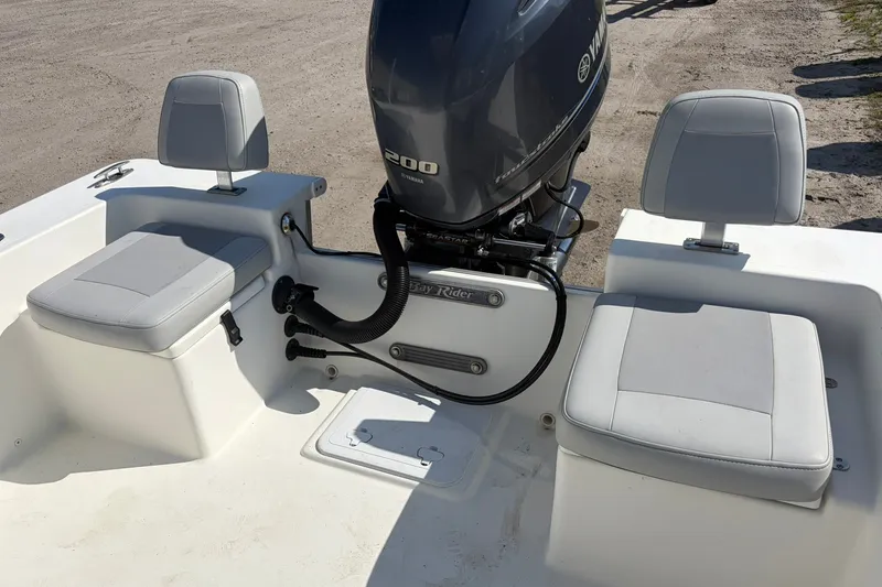 Slide: The Image of 2021 KenCraft BAYRIDER 2260FS boat interior with Yamaha 200 engine and seating. - 18