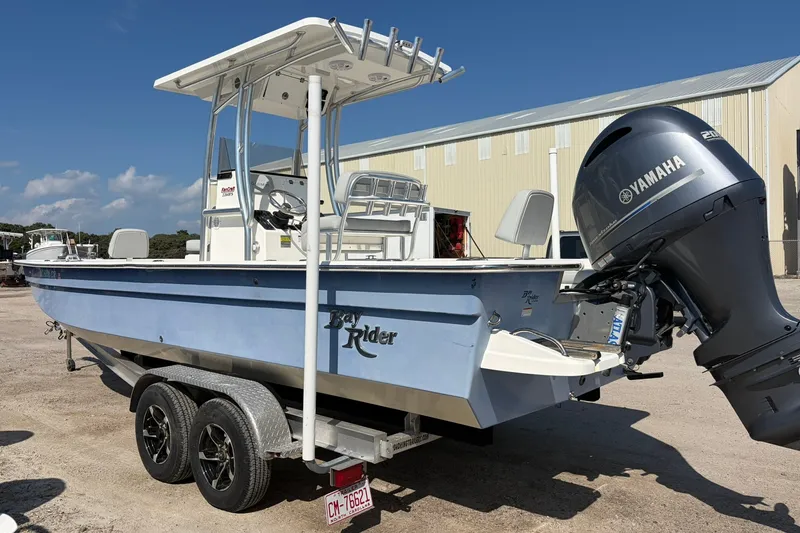 Slide: The Image of 2021 KenCraft BAYRIDER 2260FS boat with Yamaha engine on trailer, parked outdoors. - 9