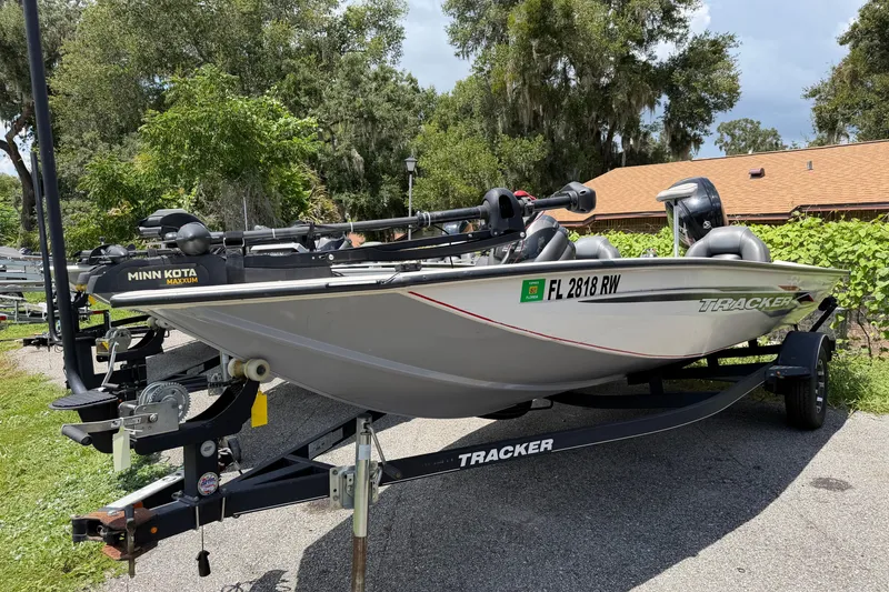 The Image of 2019 Tracker Pro Team 175 TXW boat on trailer, parked outdoors. - 0