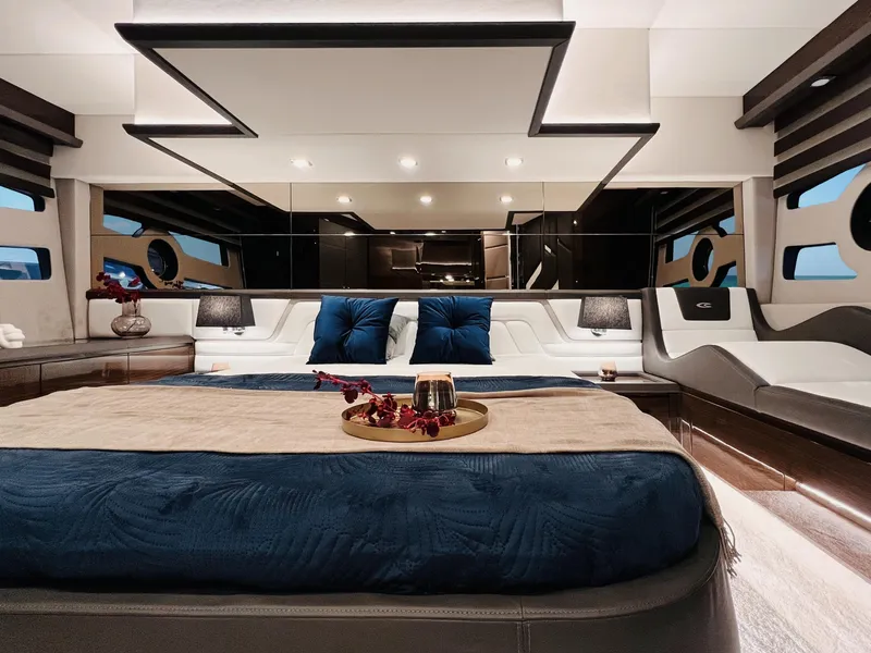 Slide: The Image of Luxurious interior of 2025 Cobrey 52 FLY yacht with elegant bedding and modern design. - 12