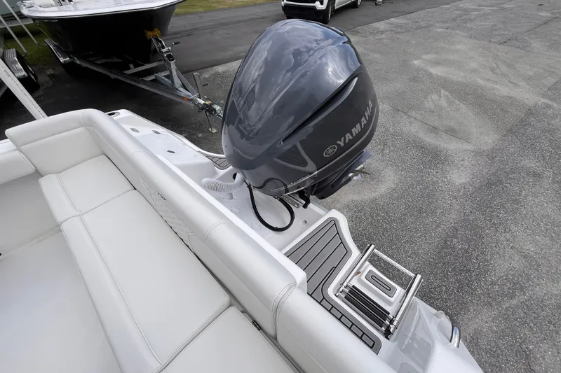 Slide: The Image of 2027 Tidewater 232 LXF boat with Yamaha outboard motor and white seating. - 13