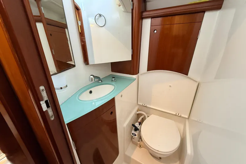 Slide: The Image of Luxurious bathroom in 2005 Beneteau 57 yacht with modern sink and toilet. - 25