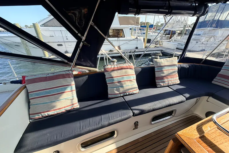 Slide: The Image of Luxurious seating area on a 2005 Beneteau 57 yacht with striped cushions. - 30
