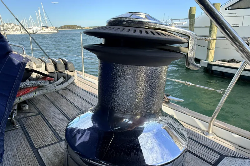 Slide: The Image of Winch on 2005 Beneteau 57 sailboat deck, docked in marina. - 38