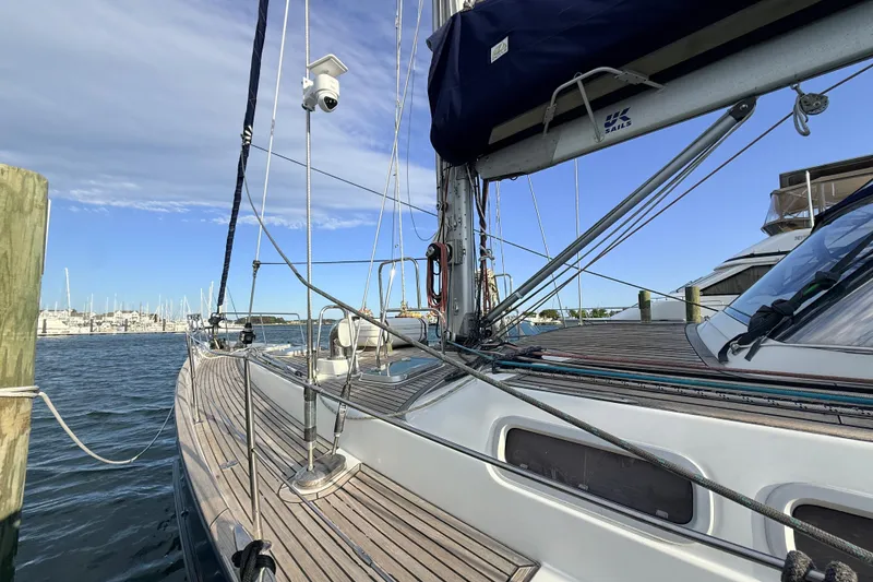 Slide: The Image of 2005 Beneteau 57 sailboat docked, showcasing deck and rigging details. - 34
