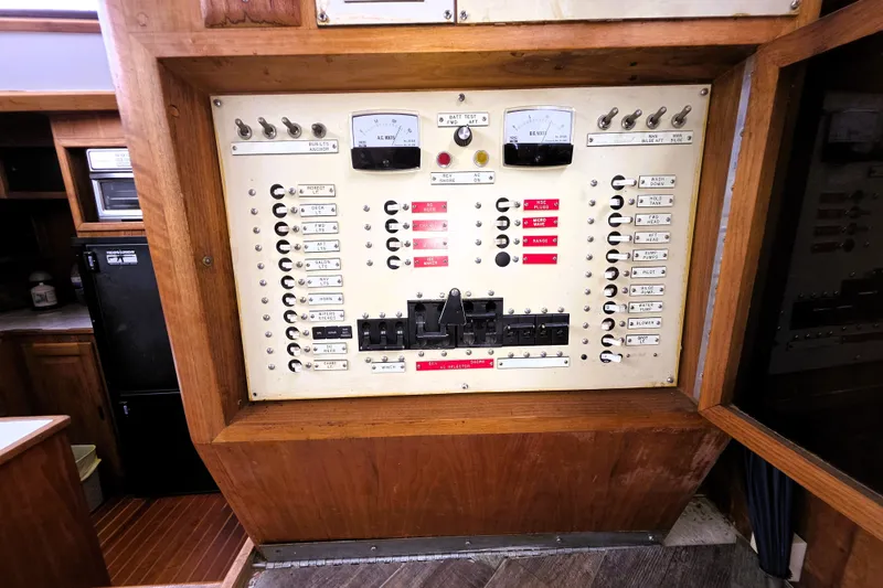 Slide: The Image of Electrical panel of a 1984 Californian 43 Motoryacht, featuring switches and meters. - 20