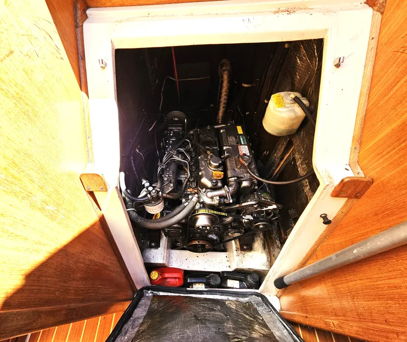 Slide: The Image of The engine compartment of a 1999 Catalina 42 MkII reveals a well-maintained engine. - 43
