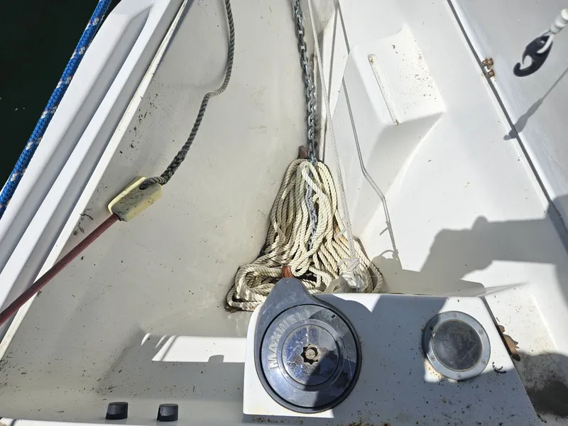 Slide: The Image of The anchor locker of a 1999 Catalina 42 MkII with chain and rope. - 10