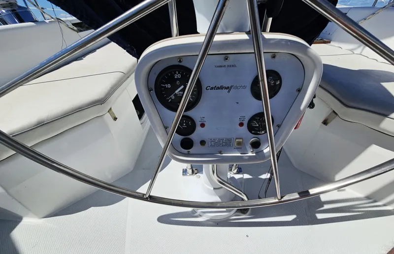 Slide: The Image of The image shows the helm of a 1999 Catalina 42 MkII with various instruments. - 15