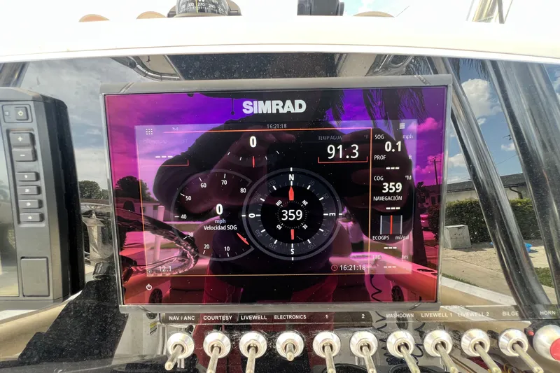 Slide: The Image of Simrad display on 2016 Sportsman Heritage 231 Center Console boat dashboard. - 23