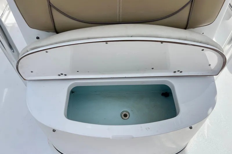 Slide: The Image of Open storage compartment on 2016 Sportsman Heritage 231 Center Console boat. - 44