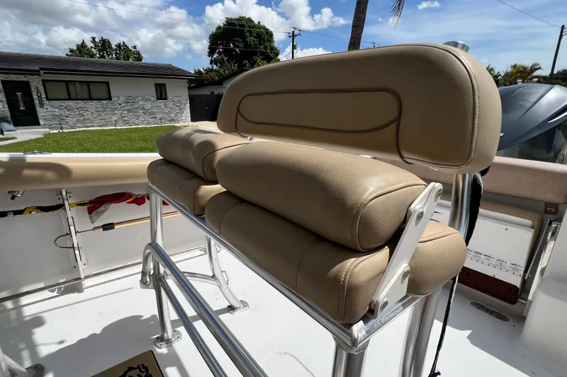 Slide: The Image of 2016 Sportsman Heritage 231 Center Console boat with tan seating and stainless steel frame. - 45