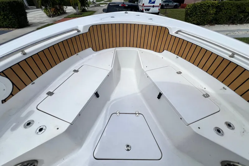 Slide: The Image of 2016 Sportsman Heritage 231 Center Console boat interior with seating and storage compartments. - 34