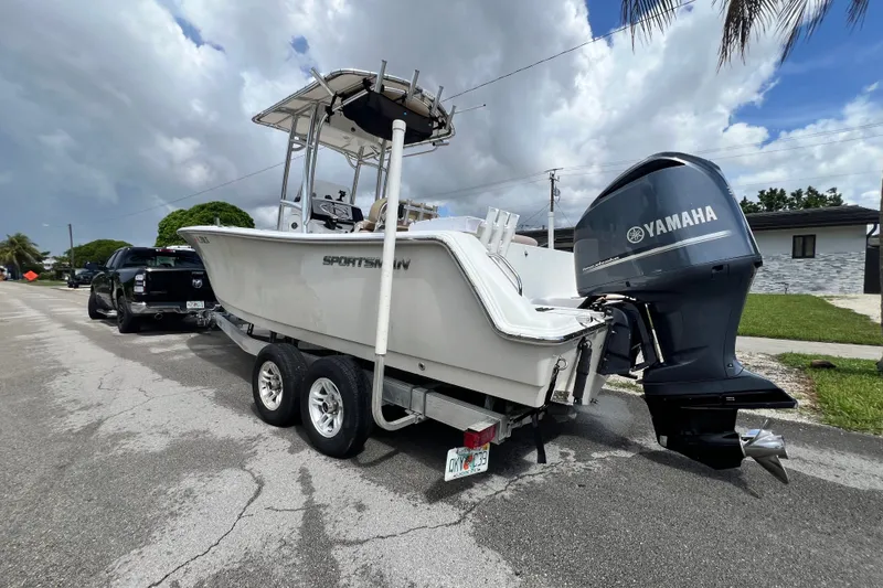 Slide: The Image of 2016 Sportsman Heritage 231 Center Console boat with Yamaha engine on trailer. - 2