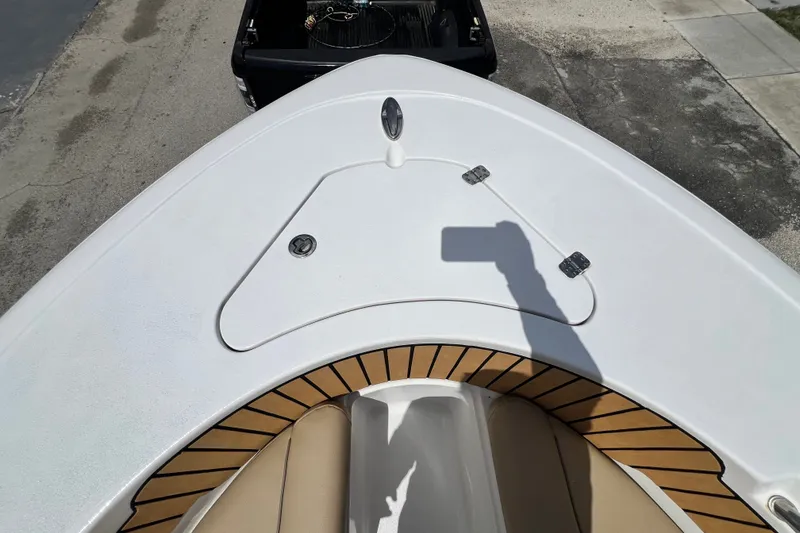 Slide: The Image of 2016 Sportsman Heritage 231 Center Console boat deck with seating and storage compartment. - 36
