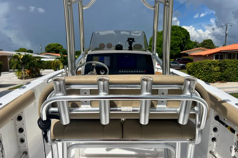 Slide: The Image of 2016 Sportsman Heritage 231 Center Console boat with rod holders and steering console. - 16