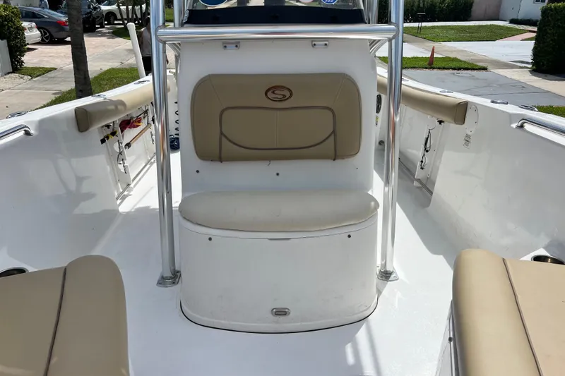 Slide: The Image of 2016 Sportsman Heritage 231 Center Console boat interior with beige seating and stainless steel rails. - 41