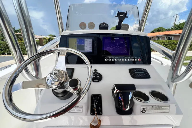 Slide: The Image of 2016 Sportsman Heritage 231 Center Console dashboard with steering wheel and navigation displays. - 19