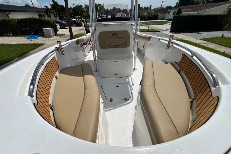 Slide: The Image of 2016 Sportsman Heritage 231 Center Console boat interior with tan seating and sleek design. - 39