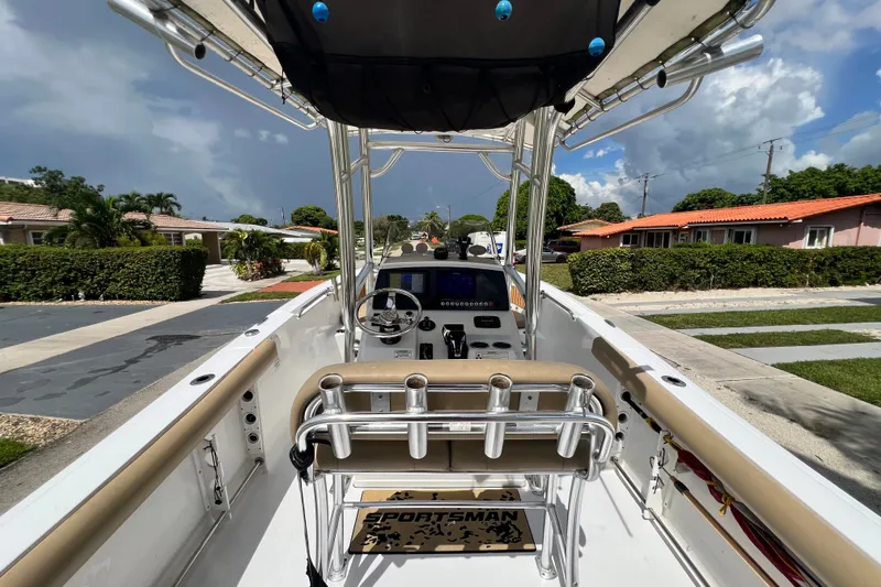 Slide: The Image of 2016 Sportsman Heritage 231 Center Console boat parked in a residential neighborhood. - 14