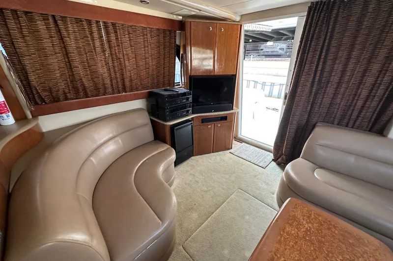 Slide: The Image of Interior of 2007 Meridian 411 Sedan yacht with leather seating and entertainment center. - 52